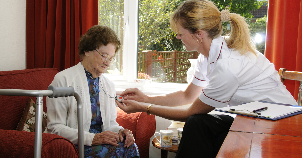 Elderly women using a medical alert system