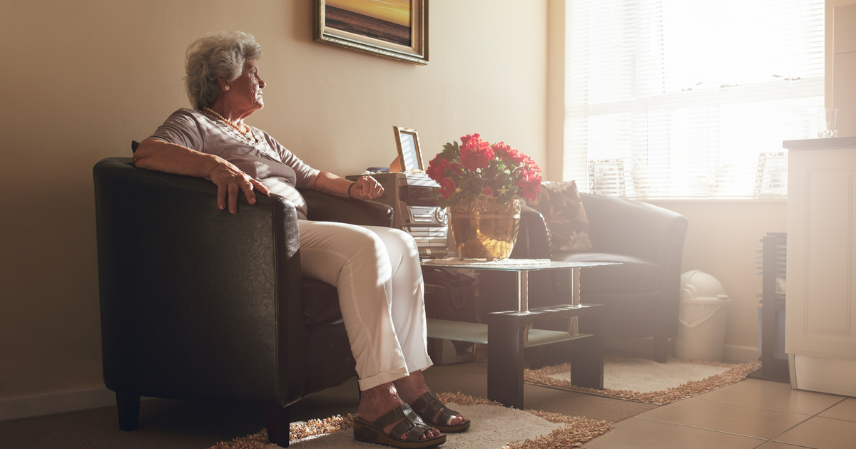 Elderly woman considering caregiving assistance