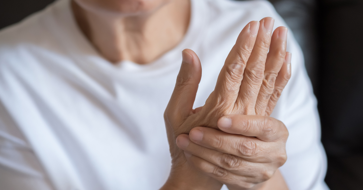 Older woman experiencing arthritis