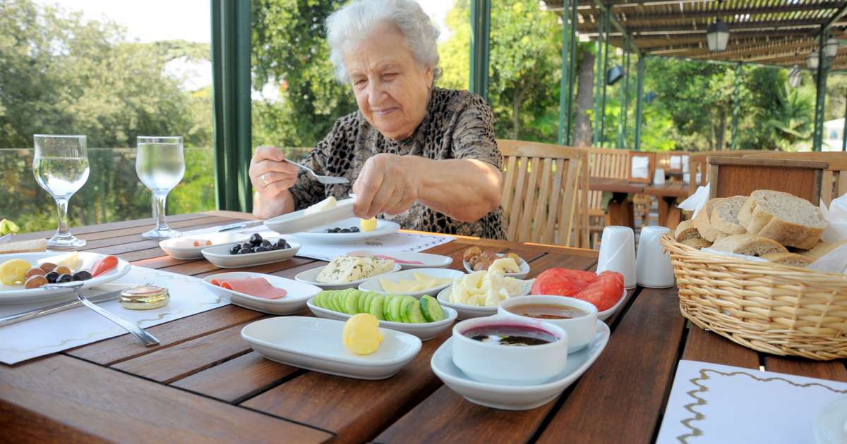 Senior woman having breakfast