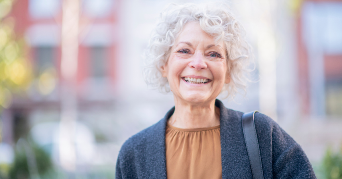 A woman dealing with senior incontinence is happy as she deals with it successfully.