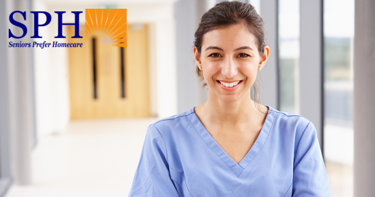 A caregiver looks happy as she looks forward to her career in home care.