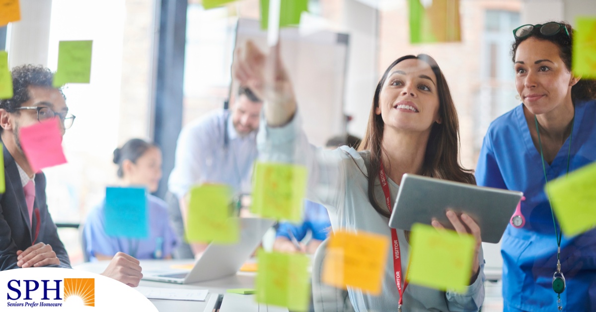 A teacher uses sticky notes as part of an innovative teaching method, representing methods that can help students apply caregiver training in a better way.