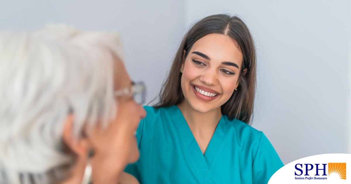 A caregiver smiles with an older client showing the results of successfully starting a new caregiving job.
