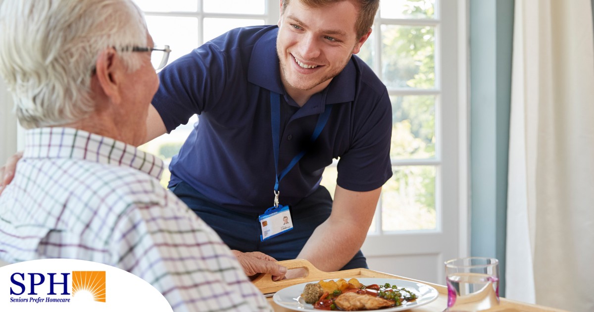 Professional caregiving involves helping clients with iADLs and ADLs as demonstrated by this caregiver helping a client by bringing a meal.