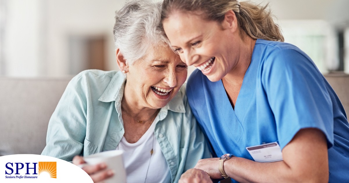 A woman in scrubs laughs with a senior woman, representing how caregiving can be a great career choice.