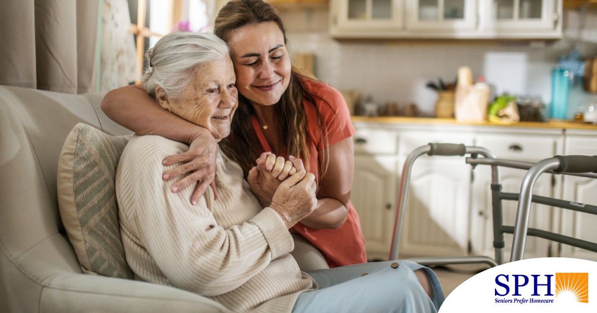 Caregiver supporting an elderly woman in the transition to senior home care