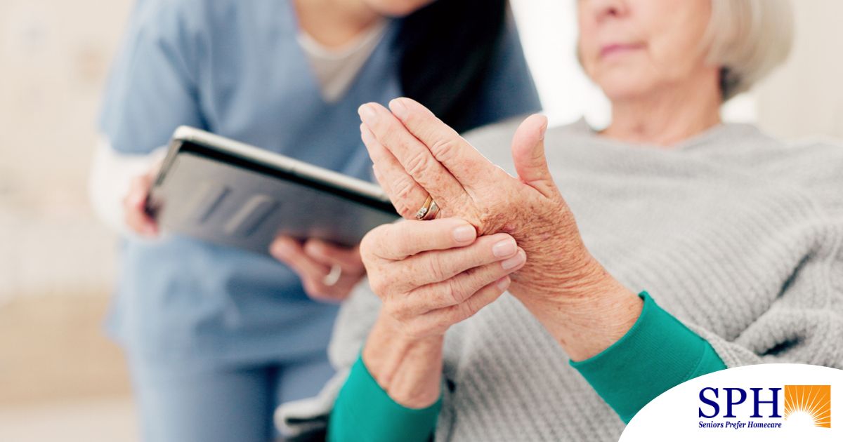 A caregiver provides in home care services to a senior with arthritis