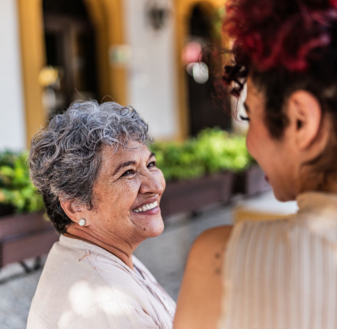 companion care in Cottondale AL — senior woman smiling warmly during an outing with her caregiver