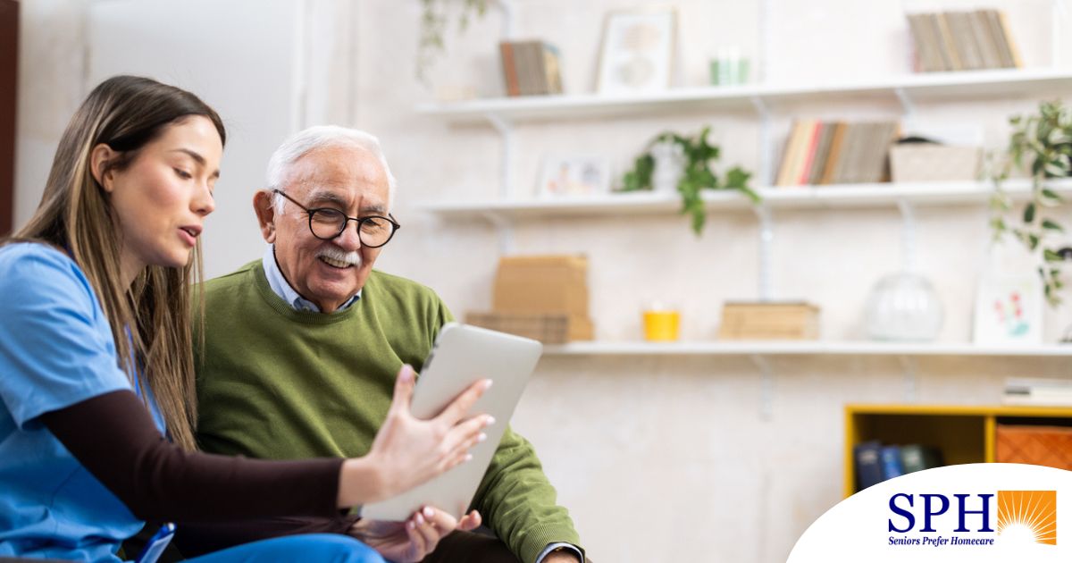 Home caregiver assisting senior man to use telehealth and senior care