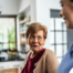 Caregiver provides attentive senior care as part of diabetes awareness