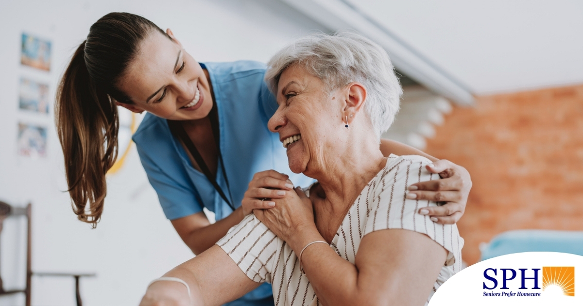 A female caregiver helping an older woman with stroke recovery at home.